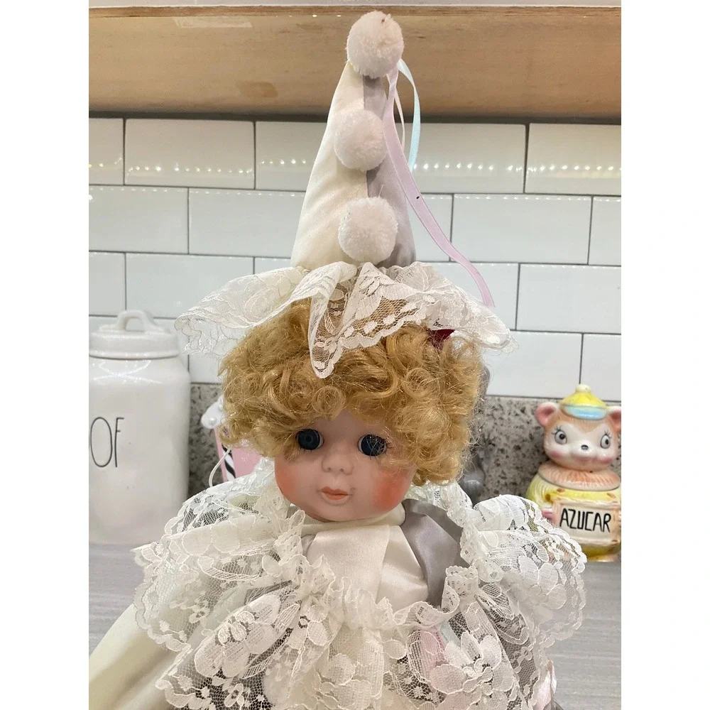 VINTAGE PORCELAIN DOLL IN CLOWN COSTUME